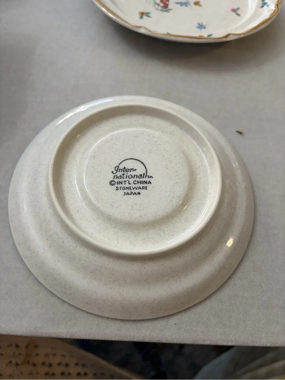 International Cream Ceramic Cup and Saucer Set with Hand-Painted Village Design